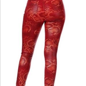 Brand new snakeskin jeans come in black and red